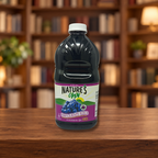 Jugo Natures Own envase de Plastico  1.89 Lts. 64 oz. — ambientación en biblioteca