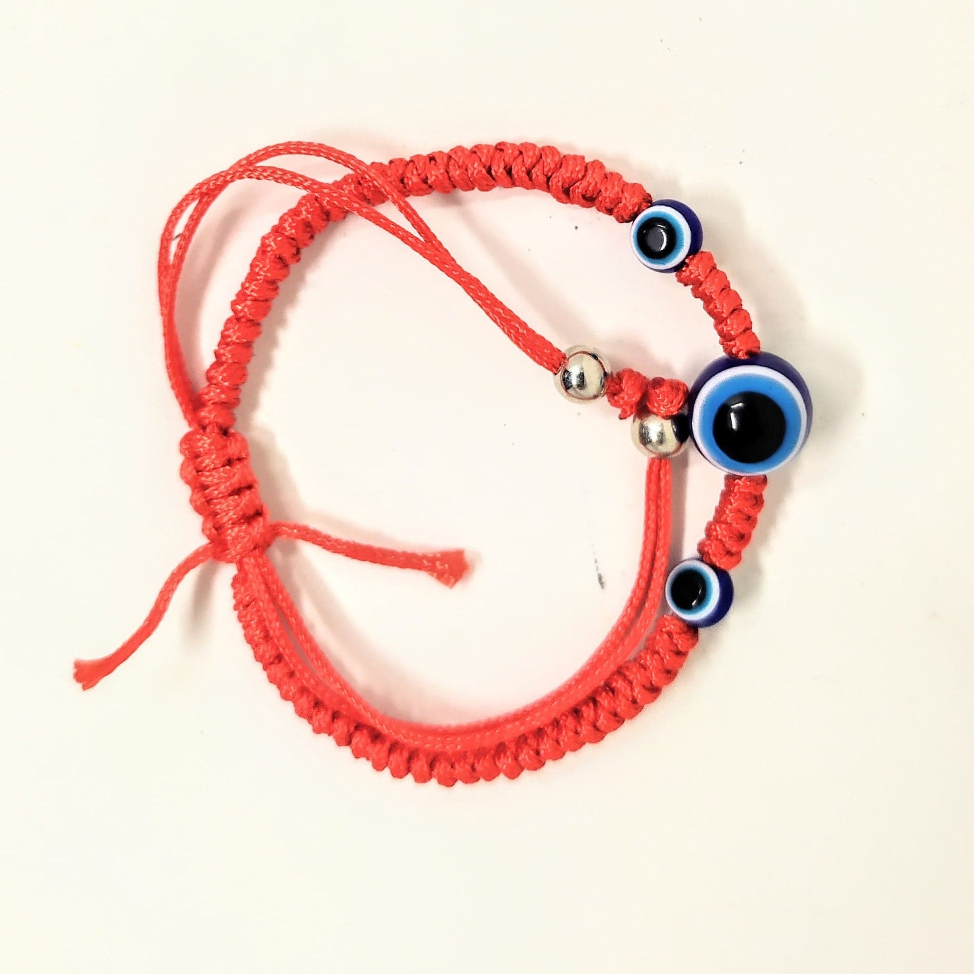 Pulsera hilo rojo trenzado con  ojitos - Libreria Jerusalem Centro